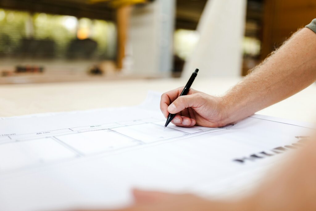 a hand writing with a pen