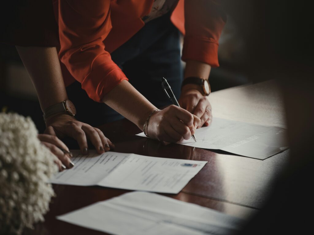 people working on paperwork